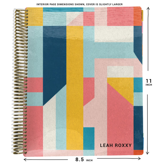 yellow, blue, pink color blocking pattern on planner Notebook with spiral binding and size dimensions labeled on a white background