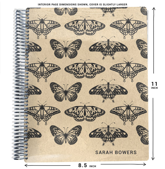 beige and black moths and butterflies pattern on planner Notebook with spiral binding and size dimensions labeled on a white background