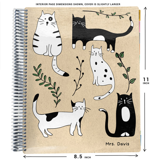 black and white cats with green leaves on beige background on planner Notebook with spiral binding and size dimensions labeled on a white background