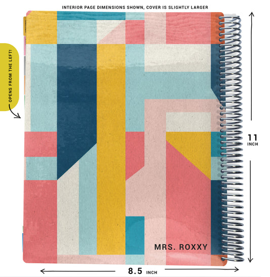 yellow, blue, pink color blocking pattern on planner Notebook with spiral binding and size dimensions labeled on a white background
