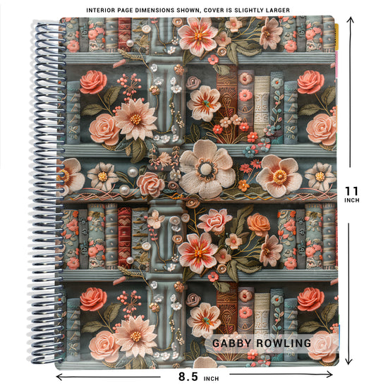 pink and blue books and flowers on bookshelf pattern on planner Notebook with spiral binding and size dimensions labeled on a white background