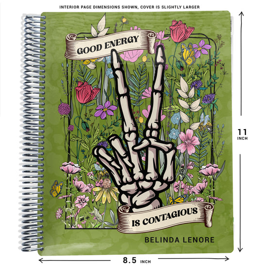 green cheetah background with pink and purple flower illustrations, and a skeleton hand pattern on planner Notebook with spiral binding on a white background with size dimensions