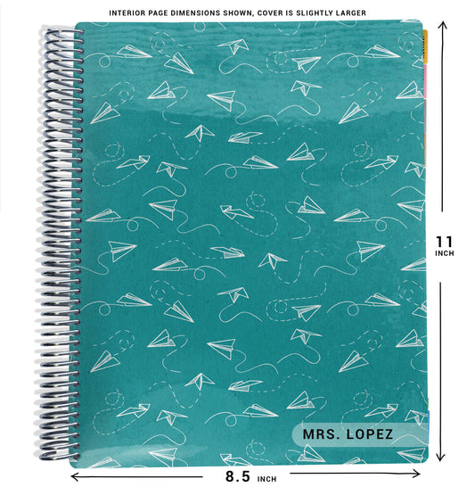 paper airplane pattern with blue background planner Notebook with spiral binding and size dimensions labeled on a white background