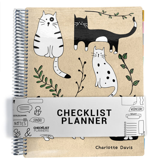 black and white cats illustrations with green leaves on beige background on planner Notebook with spiral binding