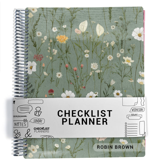 green floral pattern on planner Notebook with spiral binding on a white background
