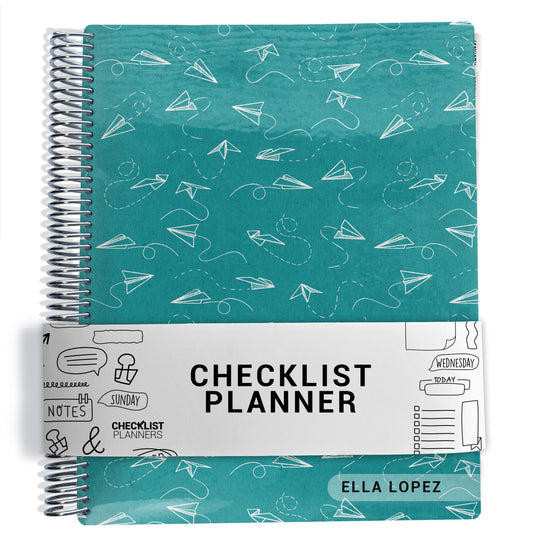 paper airplane pattern with blue background planner Notebook with spiral binding on a white background